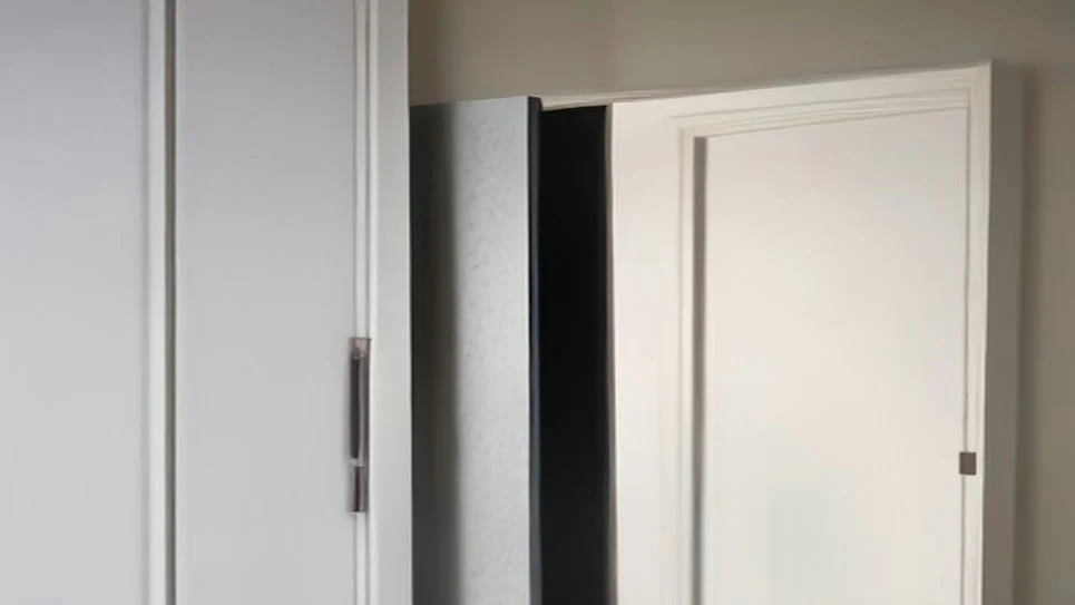 A draft stopper preventing cold air from entering a room